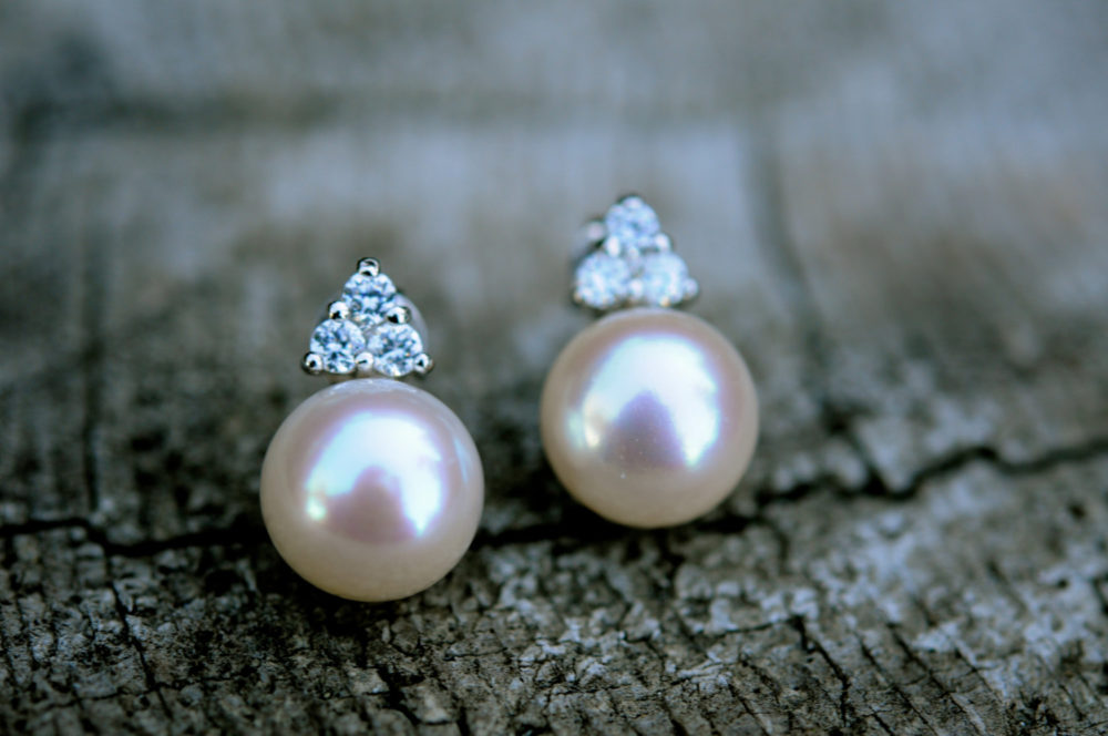 9mm white pearl with diamond cut clear crystal stud earrings, set on sterling silver