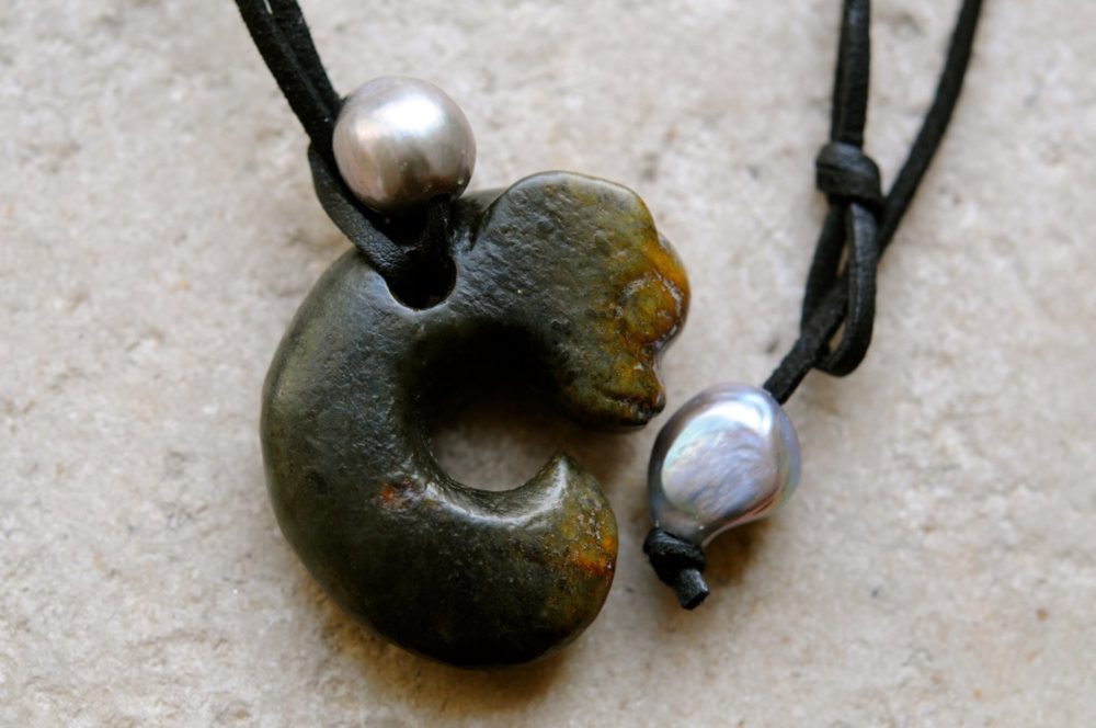a pearl and swine necklace