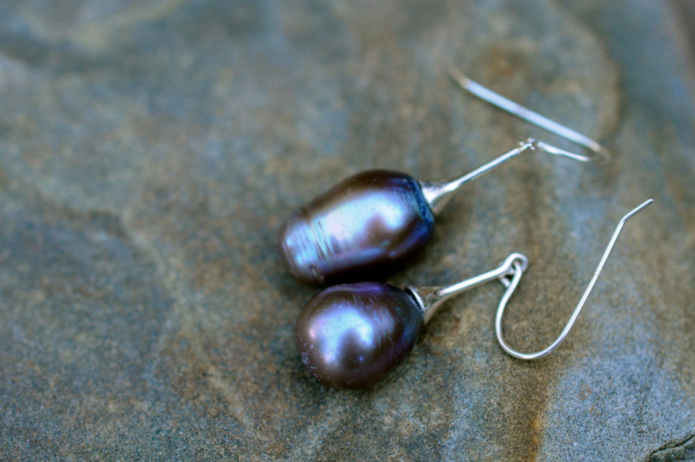 aubergine purple pearl drop earrings, purple teardrop pearls on silver dangle earrings, matched unusually with style and wit