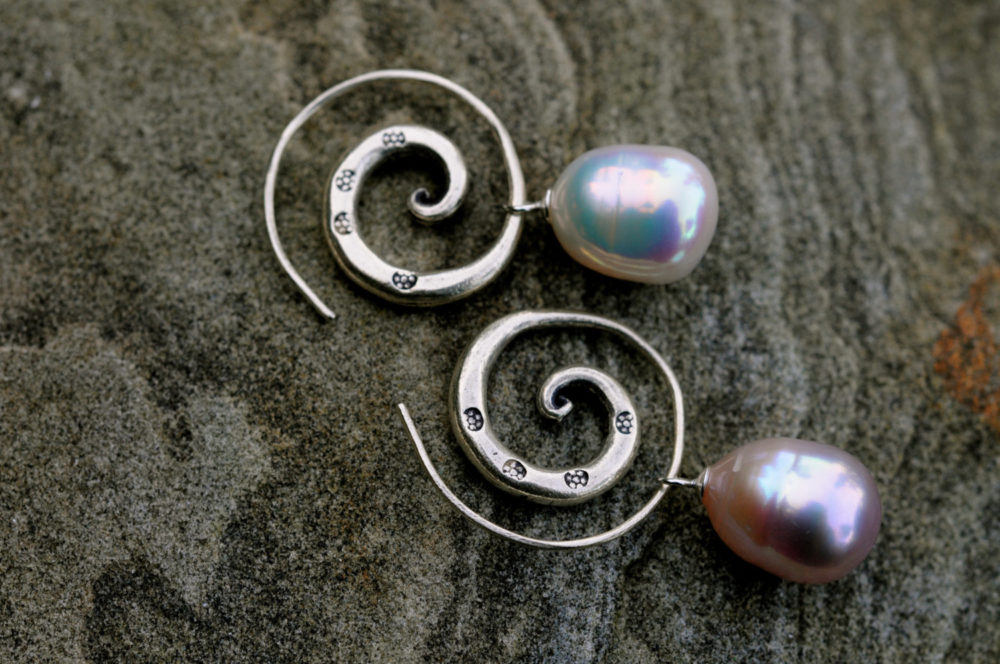 exquisite pair of freshwater pearl earrings, meticulously matched pearls, with handmade thai karen hill tribe silver spirals