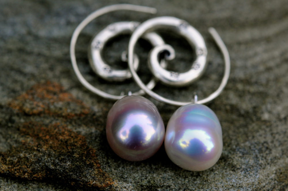 exquisite pair of freshwater pearl earrings, meticulously matched pearls, with handmade thai karen hill tribe silver spirals