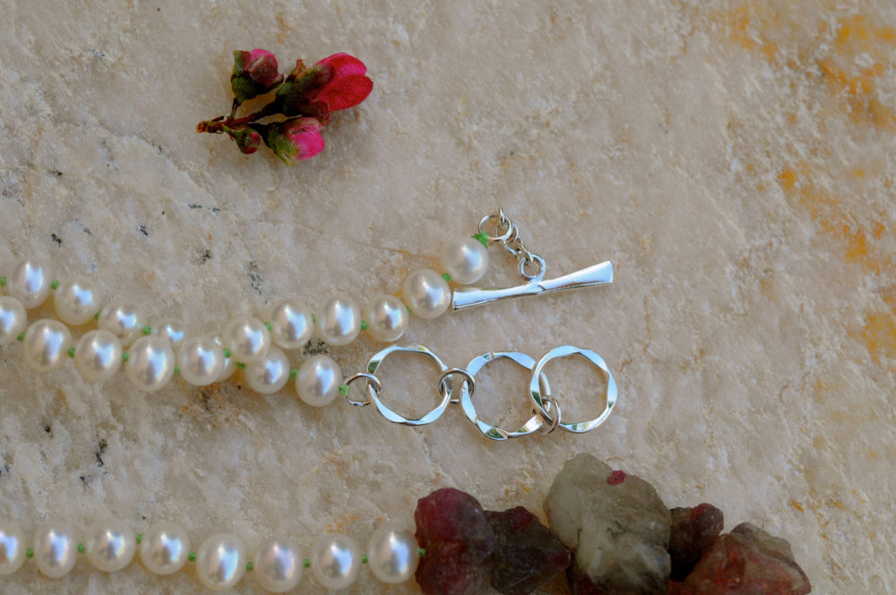 raw beauty necklace, hammer faceted rough sapphire and the finest white pearl, sterling silver toggle clasp with 2 extra rings