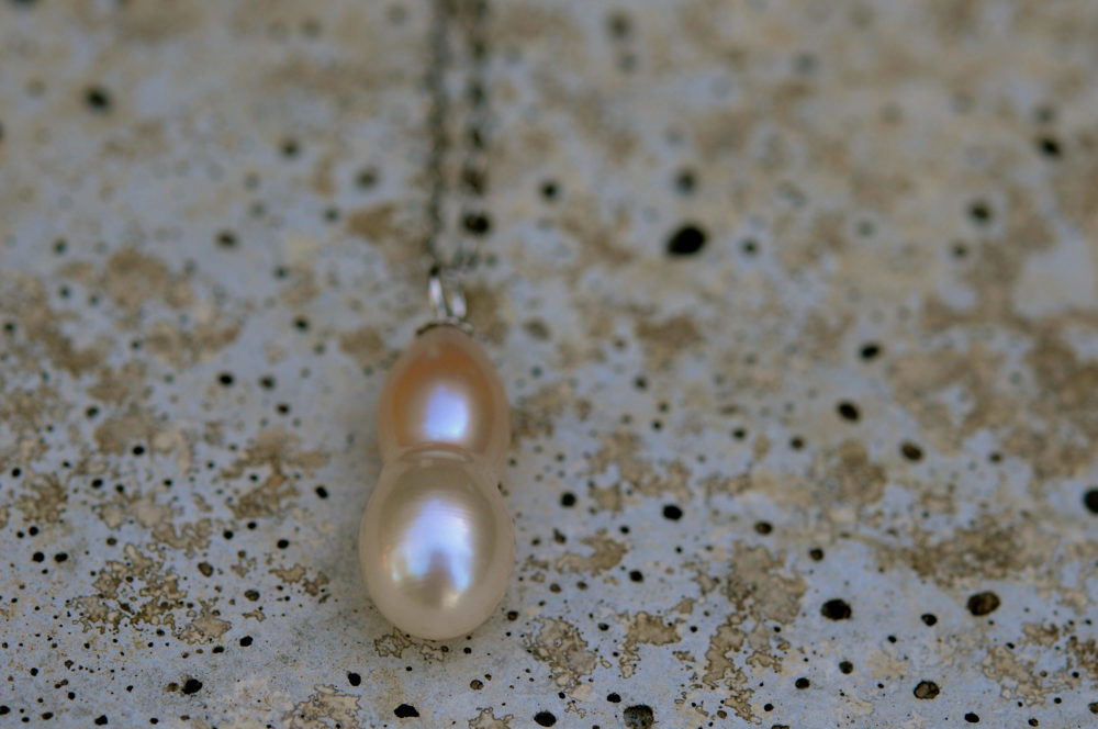 unique shape blush pink/creamy white single pearl pendant, set on sterling silver